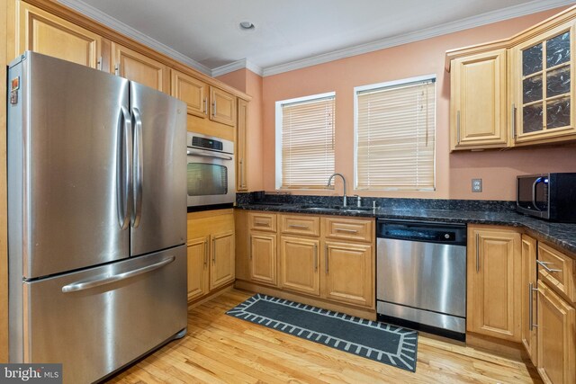 4626 Kavon Ave, Baltimore, MD 21206 - kitchen with light wood-style floors, appliances with stainless steel finishes, ornamental molding, and a sink
