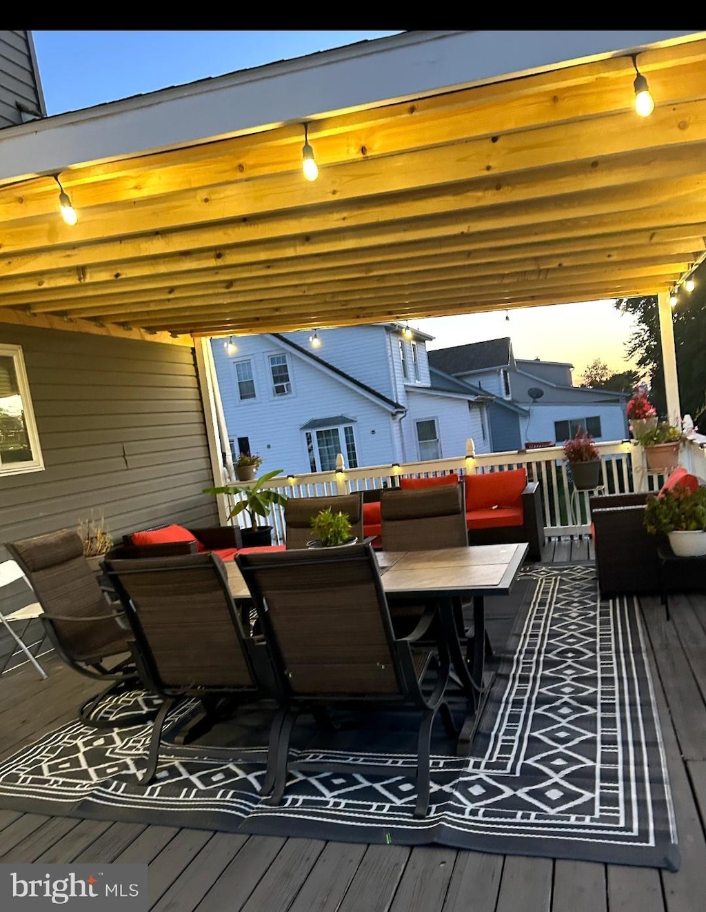 deck with outdoor dining area