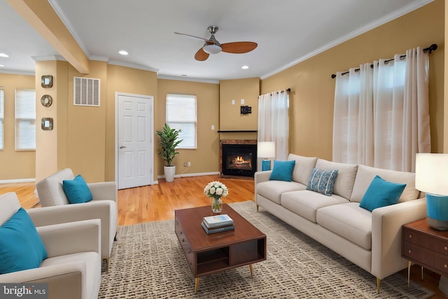 4626 Kavon Ave, Baltimore, MD 21206 - living room featuring a ceiling fan, ornamental molding, visible vents, and wood finished floors