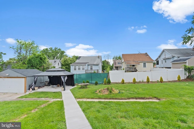 4626 Kavon Ave, Baltimore, MD 21206 - view of yard featuring fence, a gazebo, a garage, and a residential view