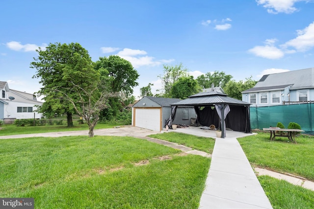 4626 Kavon Ave, Baltimore, MD 21206 - view of front of property featuring fence, a detached garage, concrete driveway, a gazebo, and a front lawn