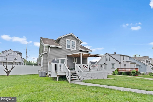 4626 Kavon Ave, Baltimore, MD 21206 - rear view of property with cooling unit, fence, a deck, and a lawn