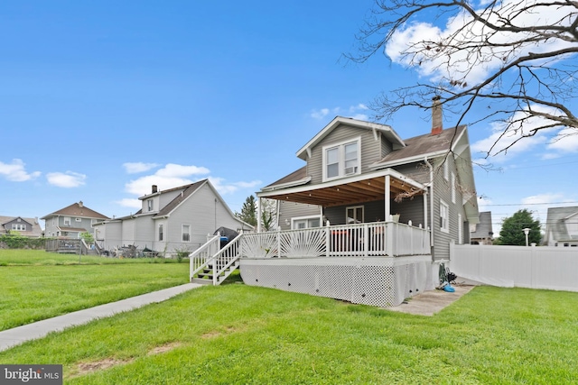 4626 Kavon Ave, Baltimore, MD 21206 - rear view of house featuring a lawn, a chimney, fence, and a wooden deck