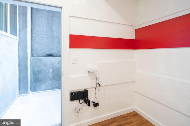 bathroom featuring baseboards and wood finished floors