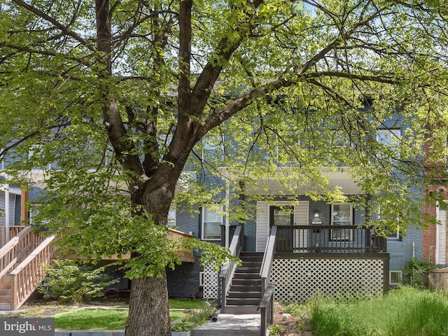 3833 Reisterstown Rd, Baltimore, MD 21215 - back of property with stairs, covered porch, and brick siding