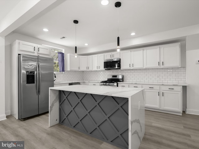 3833 Reisterstown Rd, Baltimore, MD 21215 - kitchen featuring backsplash, appliances with stainless steel finishes, baseboards, white cabinets, and light wood-style floors