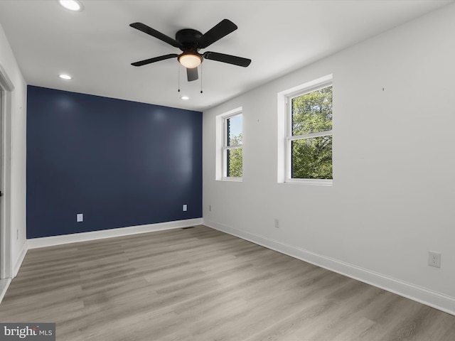 3833 Reisterstown Rd, Baltimore, MD 21215 - empty room with recessed lighting, baseboards, a ceiling fan, and light wood-style flooring