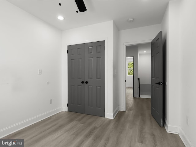 3833 Reisterstown Rd, Baltimore, MD 21215 - unfurnished bedroom with recessed lighting, baseboards, a ceiling fan, wood finished floors, and a closet