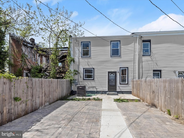 3833 Reisterstown Rd, Baltimore, MD 21215 - back of house featuring a patio, central AC, and a fenced backyard