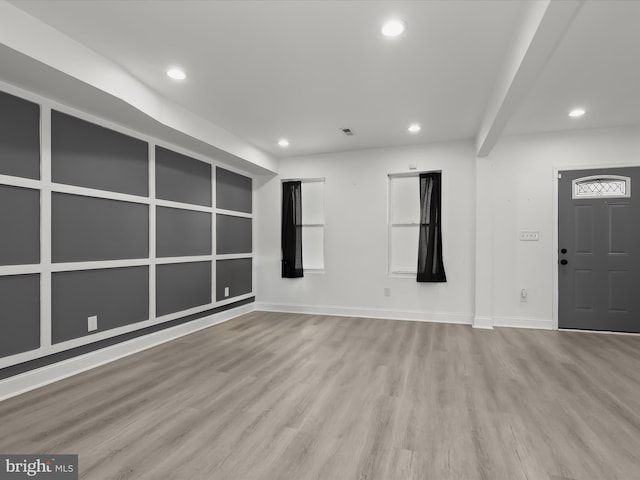 3833 Reisterstown Rd, Baltimore, MD 21215 - unfurnished living room featuring recessed lighting, baseboards, visible vents, and wood finished floors
