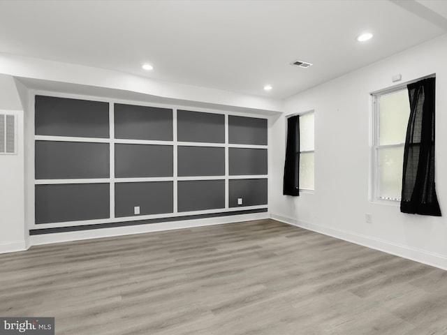 3833 Reisterstown Rd, Baltimore, MD 21215 - empty room with visible vents, recessed lighting, baseboards, and wood finished floors
