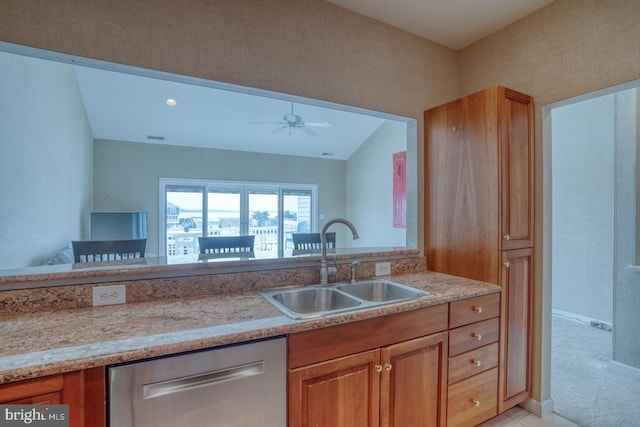 11 Marina View Ct Unit A-6, Bethany Beach, DE 19930 - kitchen with stainless steel dishwasher, a sink, brown cabinetry, and light countertops