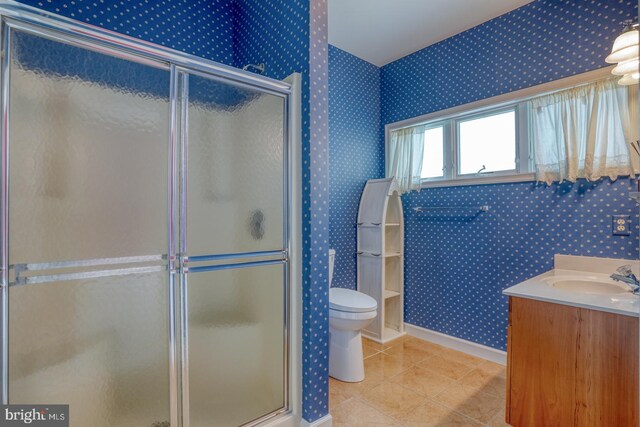 11 Marina View Ct Unit A-6, Bethany Beach, DE 19930 - bathroom with toilet, tile patterned floors, wallpapered walls, baseboards, and a stall shower