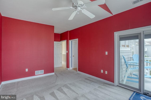 11 Marina View Ct Unit A-6, Bethany Beach, DE 19930 - spare room featuring baseboards, light carpet, a ceiling fan, and visible vents