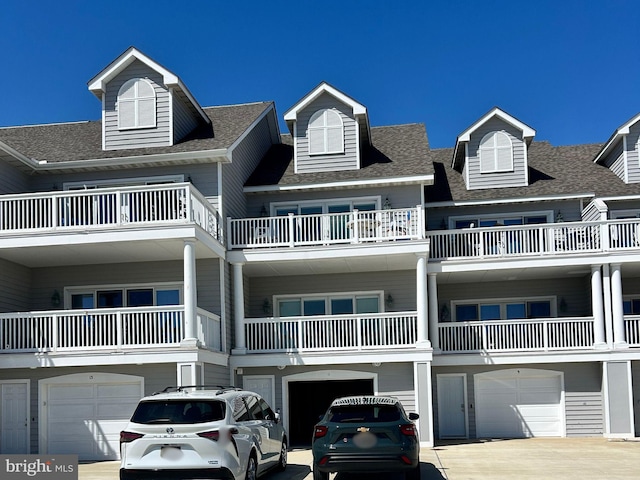 11 Marina View Ct Unit A-6, Bethany Beach, DE 19930 - view of building exterior featuring driveway and a garage