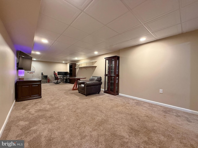 carpeted living area with baseboards and recessed lighting