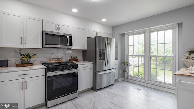 46932 Trumpet Cir, Sterling, VA 20164 - kitchen featuring stainless steel appliances, healthy amount of natural light, decorative backsplash, and recessed lighting