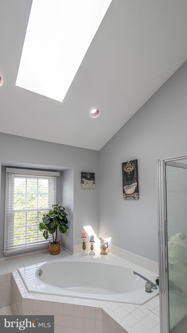 46932 Trumpet Cir, Sterling, VA 20164 - bathroom featuring a bath, a skylight, vaulted ceiling, a shower stall, and recessed lighting
