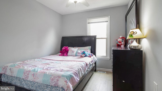 46932 Trumpet Cir, Sterling, VA 20164 - bedroom featuring multiple windows, light wood-style flooring, ceiling fan, and baseboards