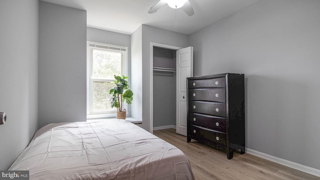 46932 Trumpet Cir, Sterling, VA 20164 - bedroom featuring wood finished floors, a closet, a ceiling fan, and baseboards