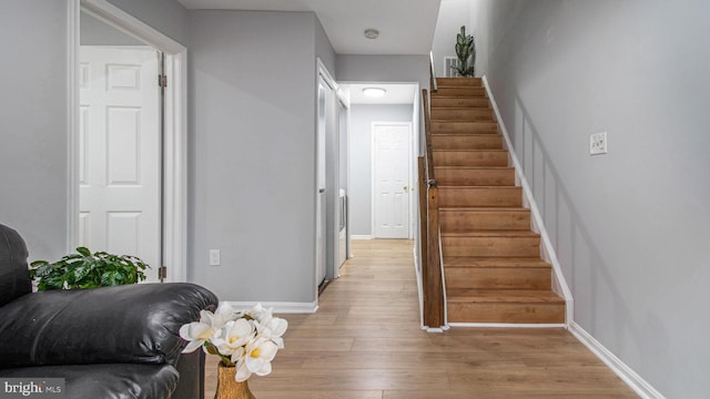 46932 Trumpet Cir, Sterling, VA 20164 - stairway featuring wood finished floors and baseboards
