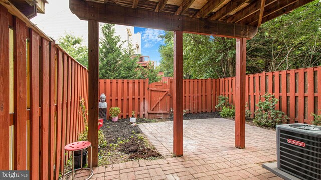 46932 Trumpet Cir, Sterling, VA 20164 - fenced backyard featuring central air condition unit, a patio, and a gate