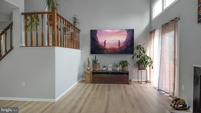 46932 Trumpet Cir, Sterling, VA 20164 - living area with wood finished floors, stairs, and baseboards