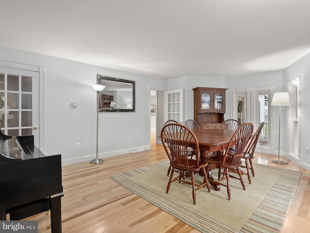 12943 Harford Rd, Hydes, MD 21082 - dining area featuring light wood-type flooring, baseboards, and french doors