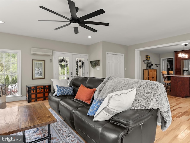 12943 Harford Rd, Hydes, MD 21082 - living area featuring a wall mounted air conditioner, french doors, recessed lighting, a ceiling fan, and light wood-style flooring