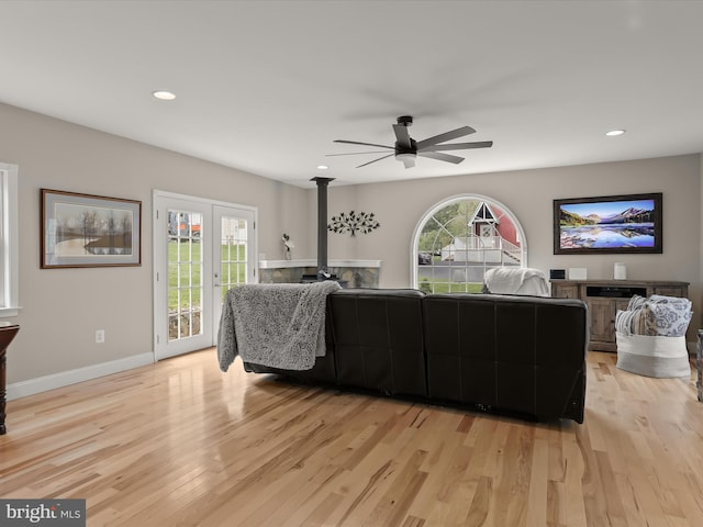 12943 Harford Rd, Hydes, MD 21082 - living area featuring light wood finished floors, a ceiling fan, recessed lighting, baseboards, and a wood stove