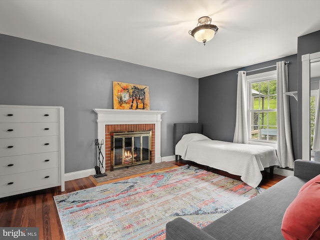 12943 Harford Rd, Hydes, MD 21082 - bedroom featuring wood finished floors, a fireplace, and baseboards