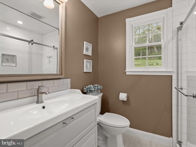 12943 Harford Rd, Hydes, MD 21082 - full bathroom featuring a stall shower, toilet, vanity, and baseboards