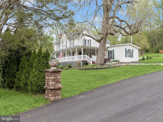 12943 Harford Rd, Hydes, MD 21082 - farmhouse inspired home with a porch, a front lawn, and a chimney