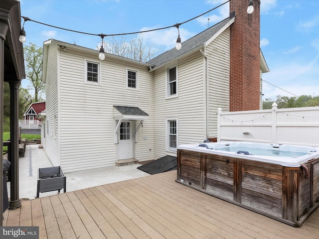 12943 Harford Rd, Hydes, MD 21082 - back of house featuring a hot tub, a deck, a chimney, and roof with shingles