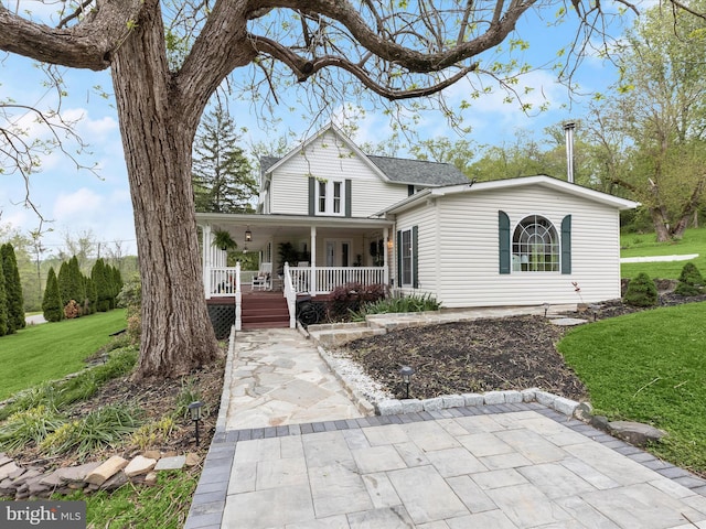 12943 Harford Rd, Hydes, MD 21082 - view of front facade with covered porch and a front lawn