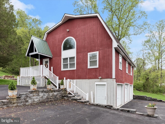 12943 Harford Rd, Hydes, MD 21082 - view of front facade with stairs, asphalt driveway, and an attached garage