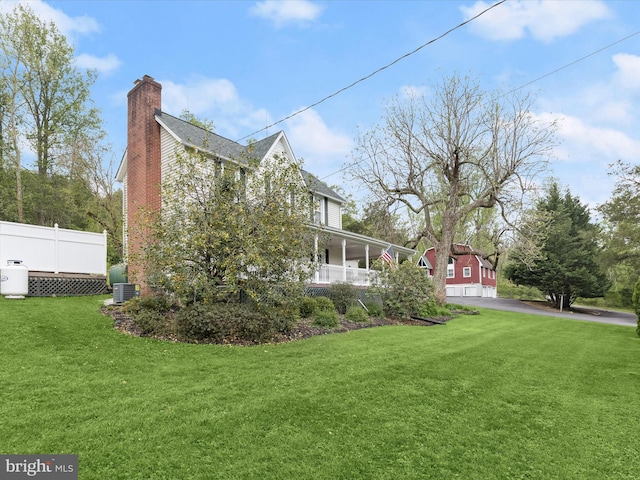 12943 Harford Rd, Hydes, MD 21082 - view of home's exterior with a chimney, a yard, and central air condition unit