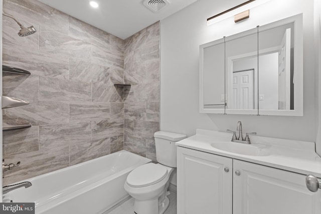 bathroom featuring visible vents, shower / bath combination, toilet, and vanity