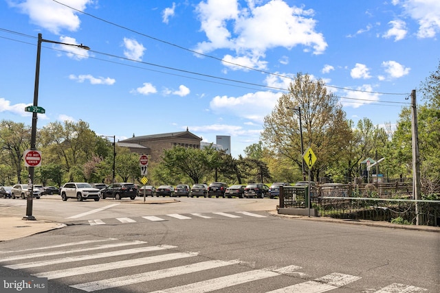 view of street with traffic signs and curbs