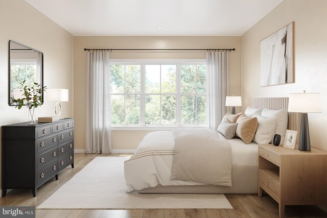 bedroom featuring light wood-style floors, baseboards, and recessed lighting