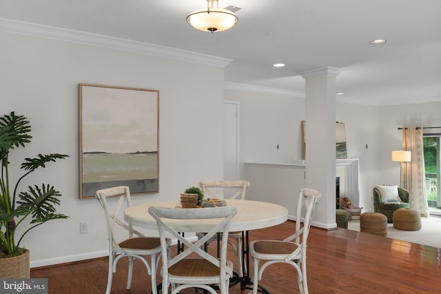 3 Spa Creek Lndg Unit A, Annapolis, MD 21403 - dining room featuring wood finished floors, crown molding, a fireplace with raised hearth, recessed lighting, and baseboards