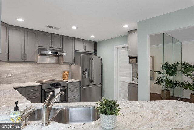 3 Spa Creek Lndg Unit A, Annapolis, MD 21403 - kitchen with stainless steel appliances, under cabinet range hood, gray cabinetry, light stone countertops, and a sink