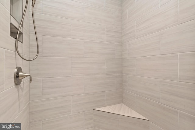 full bath featuring a tile shower