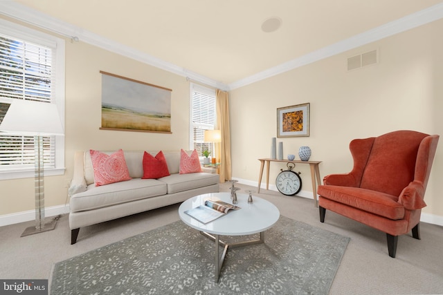 carpeted living room featuring crown molding, baseboards, visible vents, and a wealth of natural light