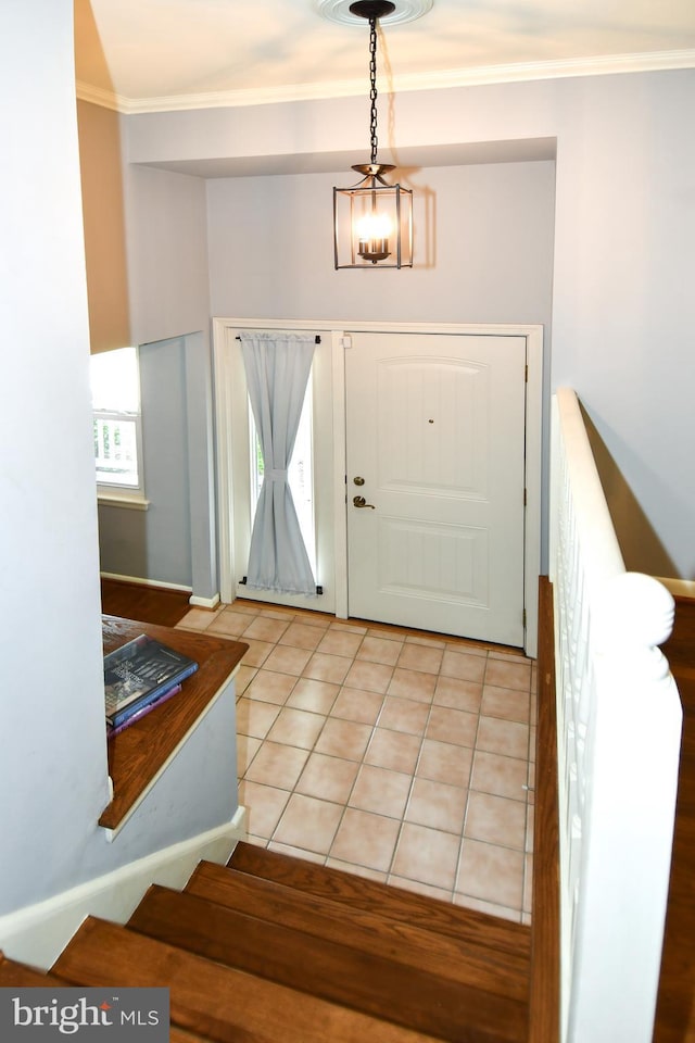 8916 Battery Rd, Alexandria, VA 22308 - entryway featuring light tile patterned flooring, crown molding, and stairs