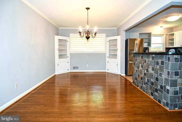 8916 Battery Rd, Alexandria, VA 22308 - unfurnished dining area with a chandelier, dark wood-style floors, ornamental molding, and baseboards