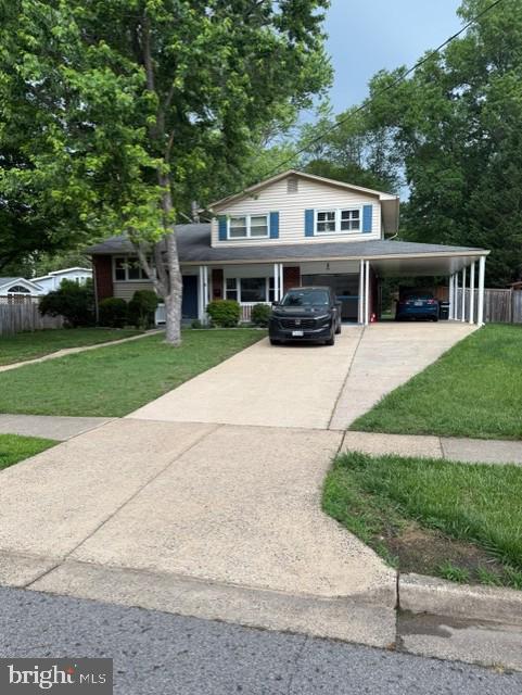 8916 Battery Rd, Alexandria, VA 22308 - view of front of home with concrete driveway and a carport