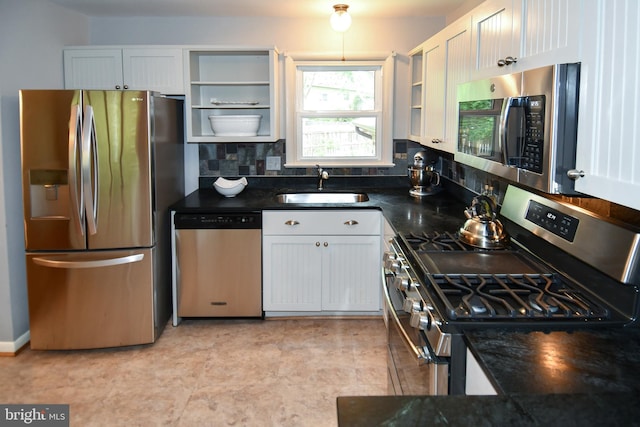 8916 Battery Rd, Alexandria, VA 22308 - kitchen with stainless steel appliances, a sink, open shelves, white cabinetry, and dark stone counters
