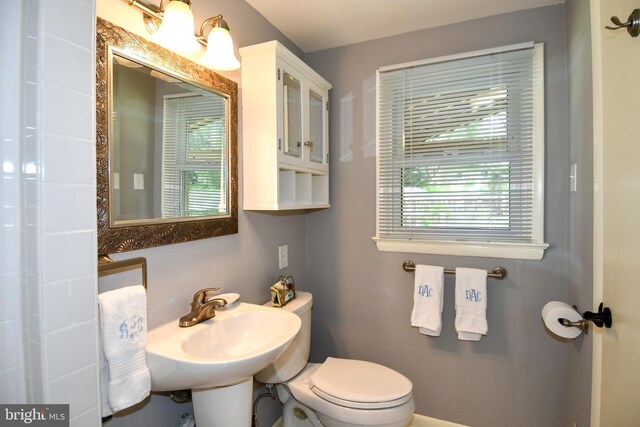 8916 Battery Rd, Alexandria, VA 22308 - half bath with plenty of natural light, a sink, and toilet