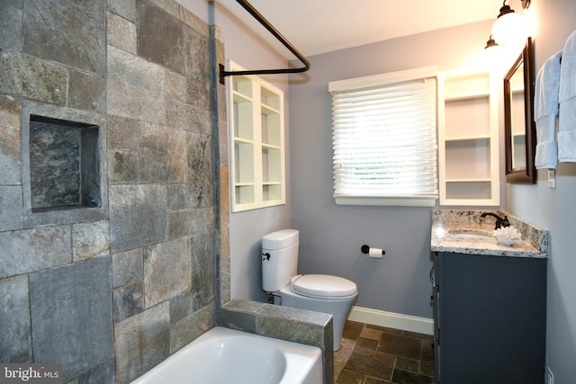 8916 Battery Rd, Alexandria, VA 22308 - bathroom with stone tile flooring, toilet, vanity, and baseboards